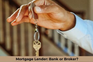 A hand is either from a mortgage lender or a mortgage bank handling keys for the home that a person has just bought.